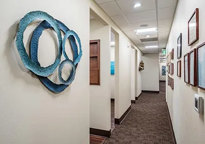 a well-decorated back hallway at Pier 210 Dental Group in Auburn, CA