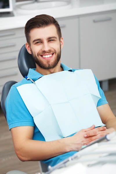 man smiling during his laser dentistry appointment at Pier 210 Dental Group